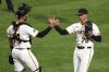 Pittsburgh Pirates pitcher Thomas Harrington (78) celebrates with catcher Joey Bart, left, after getting the final out of a baseball game against the St. Louis Cardinals in Pittsburgh, Monday, April 7, 2025. (AP Photo/Gene J. Puskar)