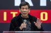 Former President of the Philippines Rodrigo Duterte speaks inside the Southorn Stadium during a thanksgiving gathering organized by Hong Kong-based Filipino workers for the former populist president in Hong Kong on Sunday, March 9, 2025. (AP Photo/Vernon Yuen)