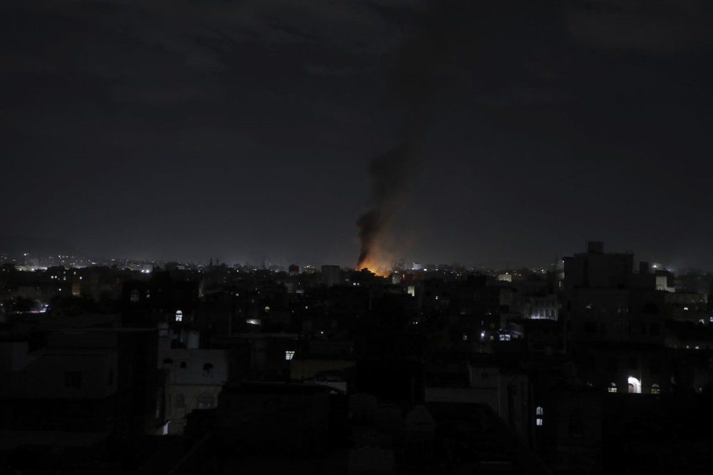 Smoke rises from a location reportedly struck by U.S. airstrikes in Sanaa, Yemen, Wednesday, March 19, 2025. (AP Photo/Osamah Abdulrahman)