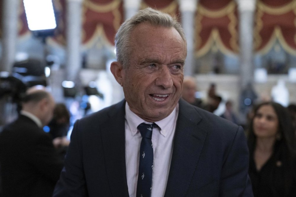 Secretary of Health and Human Services Robert F. Kennedy Jr. walks to the House Chamber before President Donald Trump addresses to a joint session of Congress at the Capitol in Washington, Tuesday, March 4, 2025. (AP Photo/Jose Luis Magana)
