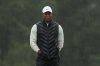 FILE - Tiger Woods walks on the 18th hole during the weather delayed second round of the Masters golf tournament at Augusta National Golf Club on April 8, 2023, in Augusta, Ga. (AP Photo/Charlie Riedel, file)