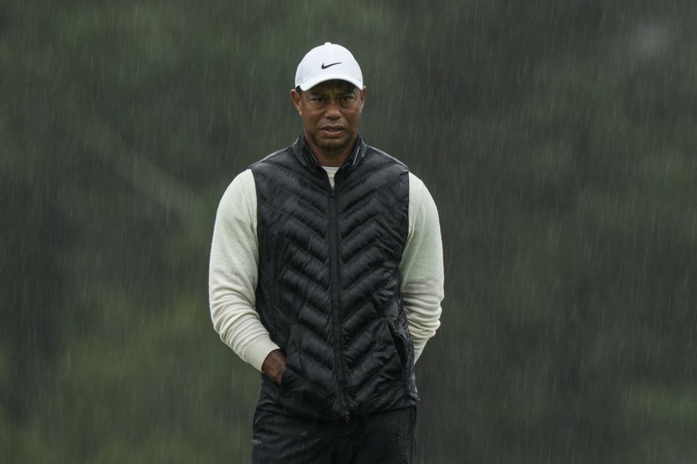 FILE - Tiger Woods walks on the 18th hole during the weather delayed second round of the Masters golf tournament at Augusta National Golf Club on April 8, 2023, in Augusta, Ga. (AP Photo/Charlie Riedel, file)