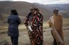 FILE- A Lesotho election official makes a phone call as he waits for last minute voters near the eastern Lesotho town of Mokhotlong Saturday May 26, 2012. (AP Photo/Jerome Delay, file)