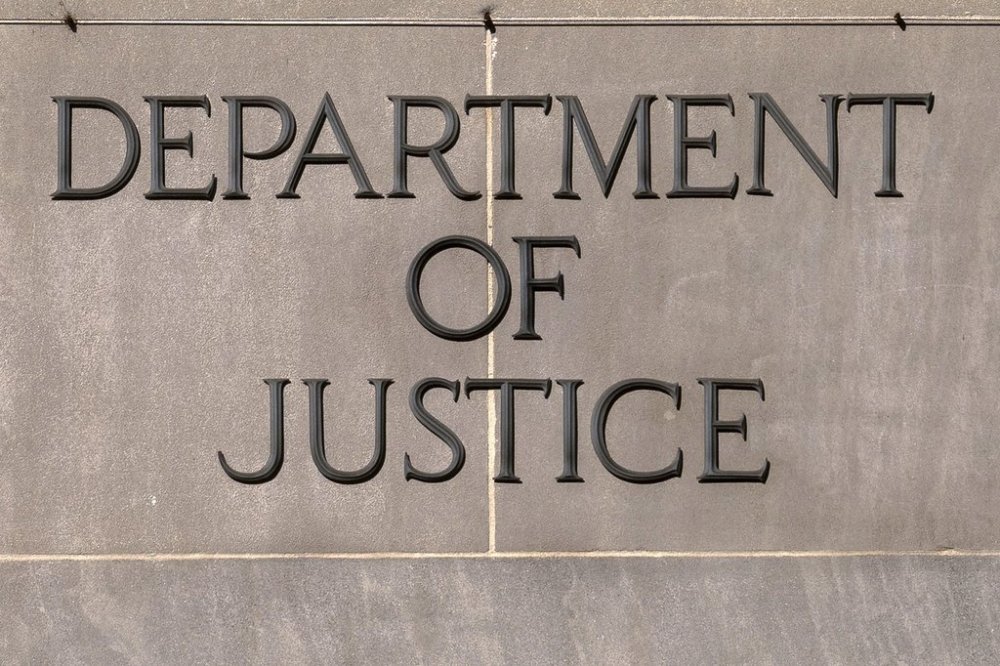 A sign of the U.S. Department of Justice is seen on the headquarters building in Washington, Monday, Nov. 18, 2024. THE CANADIAN PRESS/AP, Jose Luis Magana