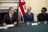 British Prime Minister Keir Starmer, left, holds a roundtable meeting with writer Jack Thorne, centre, and producer Jo Johnson at Number 10 Downing Street in London, Monday March 31, 2025. (Jack Taylor/Pool Photo via AP)
