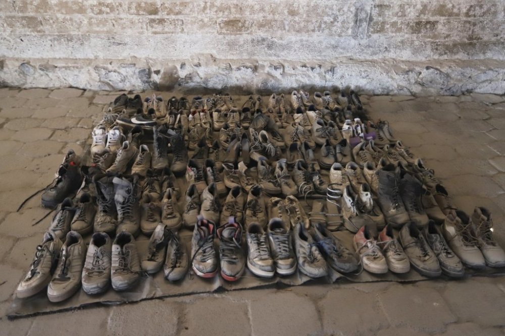 This photo released by the Jalisco State Attorney General's Office shows shoes at the Izaguirre Ranch where skeletal remains were also discovered in the municipality of Teuchitlan, Mexico, Tuesday, March 11, 2025. (Jalisco State Attorney General's Office via AP)