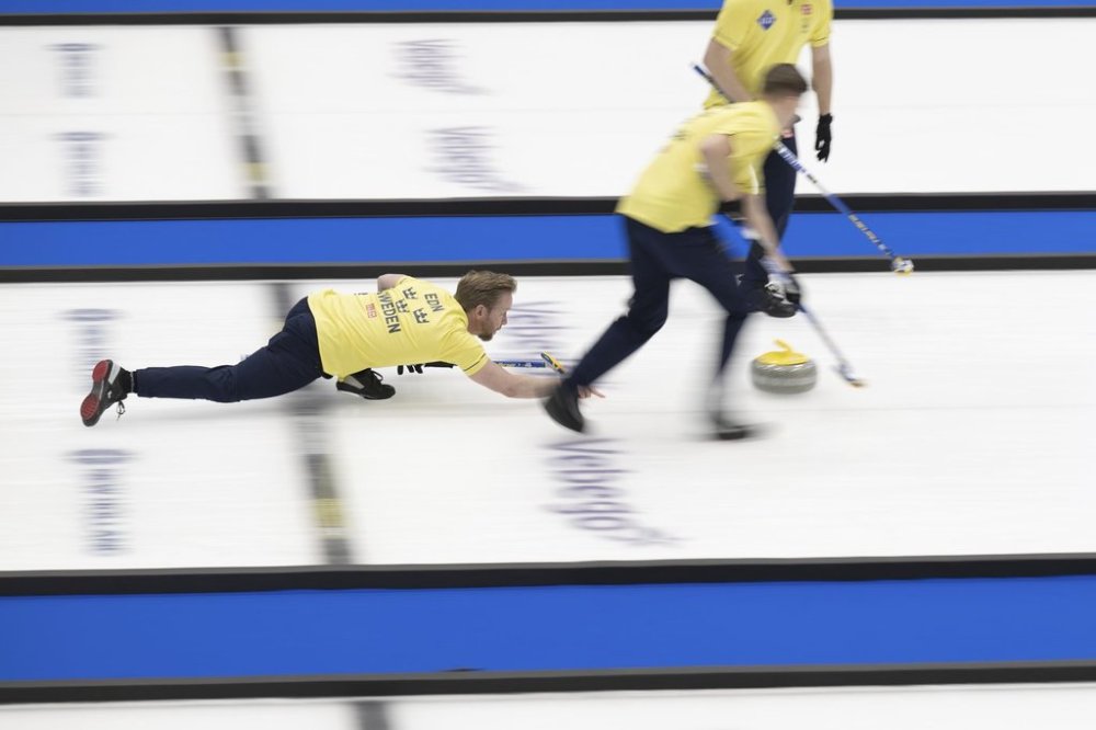 Sweden skip Niklas Edin throws a stone in the gold-medal game against Canada at the world men's curling championship at the IWC Arena in Schaffhausen, Switzerland, on Sunday, April 7, 2024. (Christian Beutler/Keystone via AP)