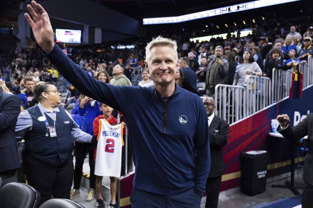 Golden State Warriors head coach Steve Kerr waves after an NBA basketball game against the New York Knicks, Saturday, March 15, 2025, in San Francisco. (AP Photo/Benjamin Fanjoy)