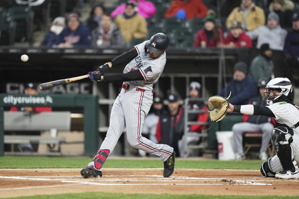 Minnesota Twins' Trevor Larnach hits a single during the first inning of a baseball game against the Chicago White Sox in Chicago, Tuesday, April 1, 2025. (AP Photo/Nam Y. Huh)