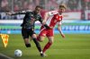 Bayern's Michael Olise, left, fights for the ball with Union's Andras Schaefer during the Bundesliga soccer match between Bayern Munich and Union Berlin at the An der Alten Forsterei stadium in Berlin, Germany, Saturday, March 15, 2025. (AP Photo/Ebrahim Noroozi)