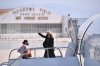 FILE - First lady Jill Biden waves as she boards a plane before departing from Meadows Field Airport in Bakersfield, Calif., April 1, 2021. (Mandel Ngan/Pool via AP, File)