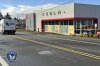 This photo provided by Tigard Police Department shows the boarded-up windows of a Tesla Dealership in Tigard, Ore., Thursday, March 13, 2025, after gunshots were fired for the second time in one week. (Tigard Police Department via AP)