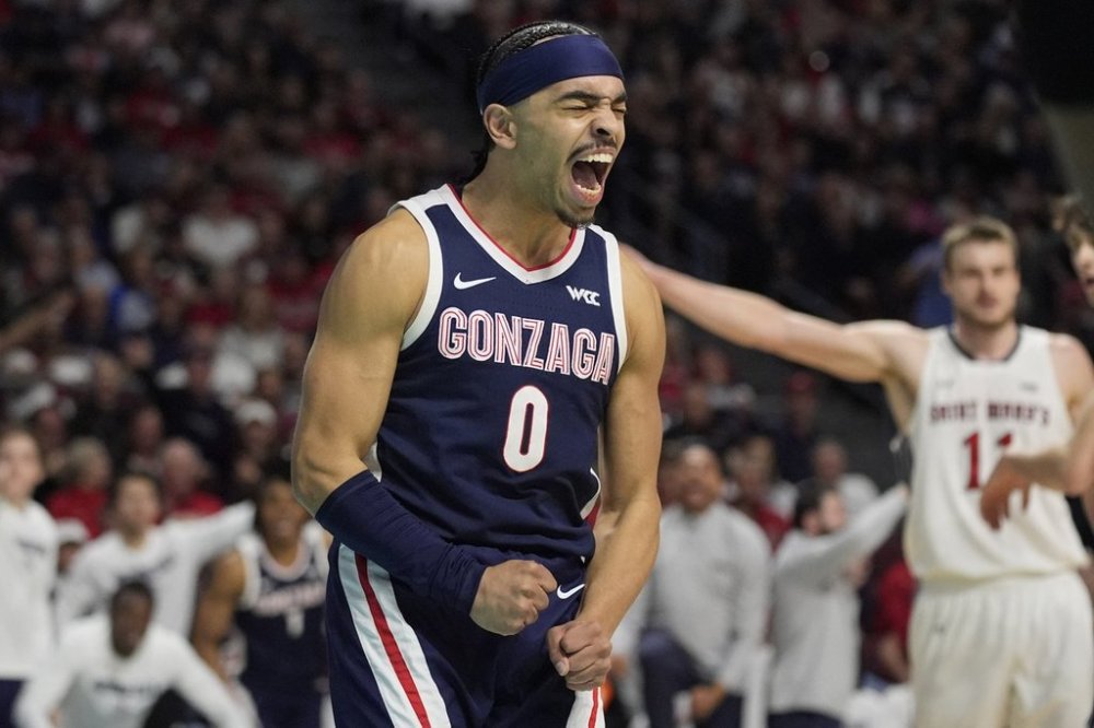 Gonzaga guard Ryan Nembhard (0) celebrates after a play against Saint Mary's during the first half of an NCAA college basketball championship game in the West Coast Conference men's tournament Tuesday, March 11, 2025, in Las Vegas. (AP Photo/John Locher)
