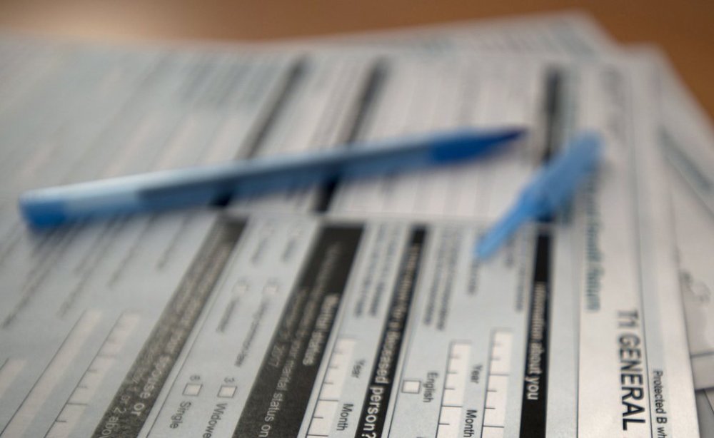 Tax forms are shown in Toronto on Thursday, April 5, 2018. THE CANADIAN PRESS/Doug Ives