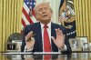 President Donald Trump speaks to reporters before signing an executive order in the Oval Office of the White House in Washington, Monday, March 31, 2025. (Pool via AP)