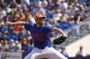 New York Mets starting pitcher Clay Holmes throws during the first inning of a spring training baseball game against the Houston Astros Saturday, Feb. 22, 2025, in Port St. Lucie, Fla. (AP Photo/Jeff Roberson)