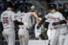 Arizona Diamondbacks' Eugenio Suárez (28) celebrates with Corbin Carroll (7) after hitting a grand slam during the eighth inning of a baseball game against the New York Yankees, Tuesday, April 1, 2025, in New York. (AP Photo/Julia Demaree Nikhinson)
