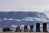 Trucks drop their loads of snow at the Angrignon snow deposit site in Montreal on Friday, Feb. 21, 2025. THE CANADIAN PRESS/Christinne Muschi