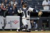 New York Yankees catcher J.C. Escarra throws to pitcher Carlos Carrasco during the first inning of a baseball game against the Arizona Diamondbacks, Thursday, April 3, 2025, in New York. (AP Photo/Julia Demaree Nikhinson)