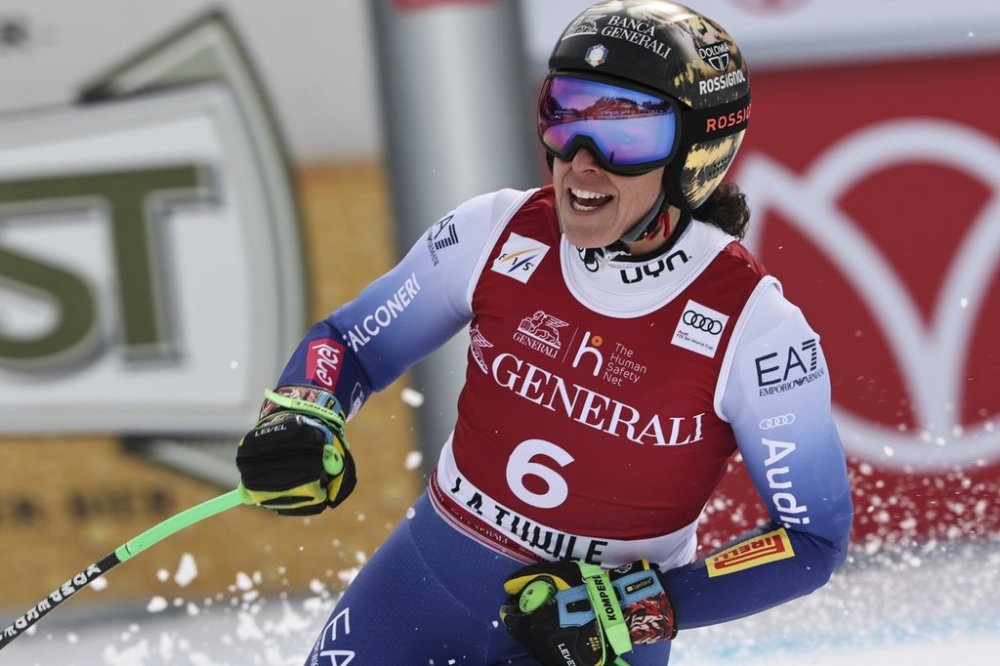 Italy's Federica Brignone reacts after completing an alpine ski, women's World Cup super G race, in La Thuile, Italy, Friday, March 14, 2025. (AP Photo/Marco Trovati)