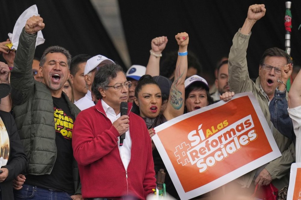 President Gustavo Petro addresses supporters during a rally he called to back his labor and health reform proposals, which have struggled to gain legislative approval, outside Congress in Bogotá, Colombia, Tuesday, March 18, 2025. (AP Photo/Fernando Vergara)