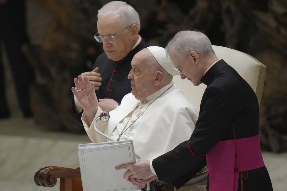 Pope Francis blesses the faithful during his weekly general audience in the Paul VI Hall, at The Vatican, Wednesday, Feb. 12, 2025. (AP Photo/Alessandra Tarantino)