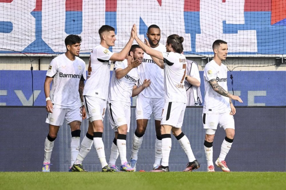 Leverkusen's Emiliano Buendia (3rd from left) celebrates scoring during the German Bundesliga soccer match between 1. FC Heidenheim and Bayer Leverkusen, at the Voith-Arena in Heidenheim, Germany, Saturday, April 5, 2025. (Harry Langer/dpa via AP)