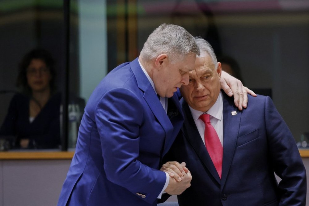 Slovakia's Prime Minister Robert Fico, left, speaks with Hungary's Prime Minister Viktor Orban during a round table meeting at an EU summit in Brussels, Thursday, March 20, 2025. (AP Photo/Omar Havana)