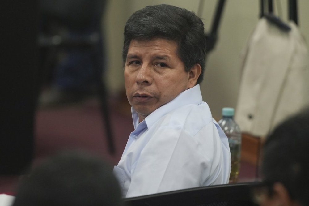 Jailed, former Peruvian President Pedro Castillo, attends his trial on charges of rebellion at a police base on the outskirts of Lima, Peru, Tuesday, March 4, 2025. (AP Photo/Guadalupe Pardo)