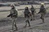 In this photo provided by Ukraine's 65th Mechanised Brigade press service, Ukrainian servicemen train at the military training ground in the Zaporizhzhia region, Ukraine, Monday, March 10, 2025. (Andriy Andriyenko/Ukraine's 65th Mechanised Brigade via AP)