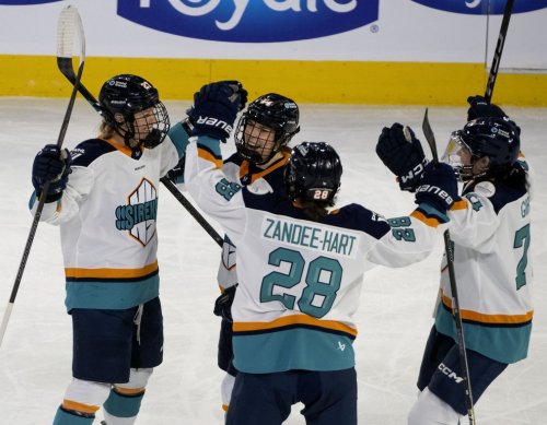 New York Sirens' Jade Downie-Landry (27) celebrates with teammates after scoring on Montreal Victoire during first period PWHL hockey action in Laval, Que., Tuesday, April 1, 2025. THE CANADIAN PRESS/Peter McCabe