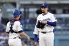 Los Angeles Dodgers' Blake Snell, right, gets a visit from catcher Will Smith during the second inning of a baseball game against the Atlanta Braves Wednesday, April 2, 2025, in Los Angeles. (AP Photo/Kevork Djansezian)