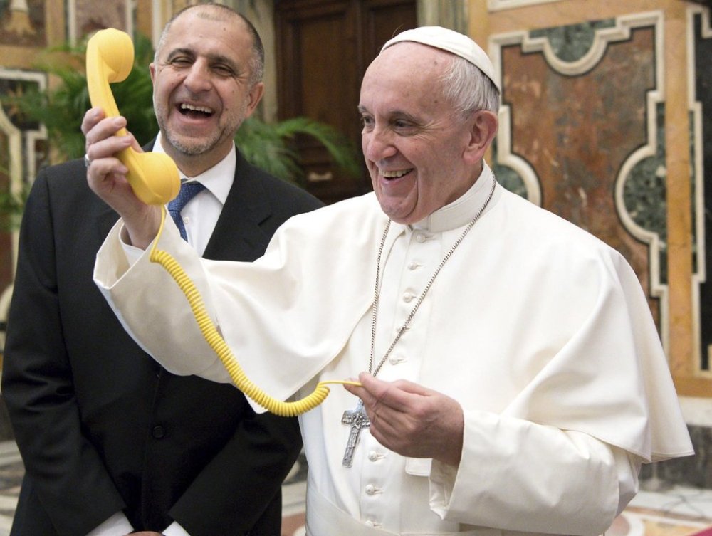FILE - Pope Francis shares a light moment with