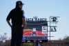 FILE - A replay from the Automated Ball-Strike System plays after a play was challenged is displayed on the scoreboard during the second inning of a spring training baseball game between the Seattle Mariners and the Los Angeles Dodgers, Tuesday, Feb. 25, 2025, in Phoenix. (AP Photo/Ashley Landis, File)
