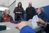 NDP Leader Jagmeet Singh, second left, and NDP candidate Monique Taylor, second right, visits with people while they play bridge at a recreation centre during a federal election campaign stop in Hamilton, Ont., Wednesday, March 26, 2025. THE CANADIAN PRESS/Nathan Denette