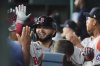 Boston Red Sox's Wilyer Abreu celebrates with the team in the dugout after hitting a solo home run in the fifth inning of an opening-day baseball game against the Texas Rangers, Thursday, March 27, 2025, in Arlington, Texas. (AP Photo/Tony Gutierrez)