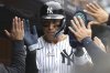 New York Yankees' Aaron Judge reacts after scoring on a wild pitch by Milwaukee Brewers' pitcher Jared Koenig during the sixth inning of a baseball game, Sunday, March 30, 2025, in New York. (AP Photo/Pamela Smith)