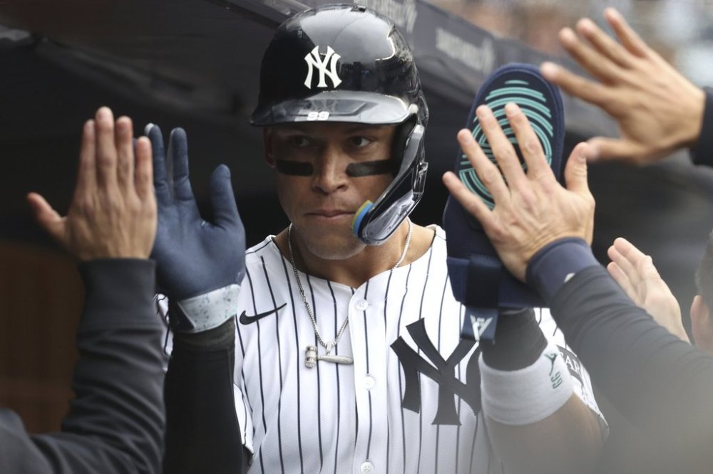 New York Yankees' Aaron Judge reacts after scoring on a wild pitch by Milwaukee Brewers' pitcher Jared Koenig during the sixth inning of a baseball game, Sunday, March 30, 2025, in New York. (AP Photo/Pamela Smith)