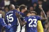Tottenham's Rodrigo Bentancur, center, clashes with Chelsea's Trevoh Chalobah, right, during the English Premier League soccer match between Chelsea and Tottenham Hotspur, at Stamford Bridge stadium, in London, Thursday, April 3, 2025. (AP Photo/Ian Walton)