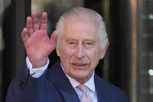 FILE - Britain's King Charles III waves as he arrives for a visit to University College Hospital Macmillan Cancer Centre in London, Tuesday, April 30, 2024. (AP Photo/Kin Cheung, File)