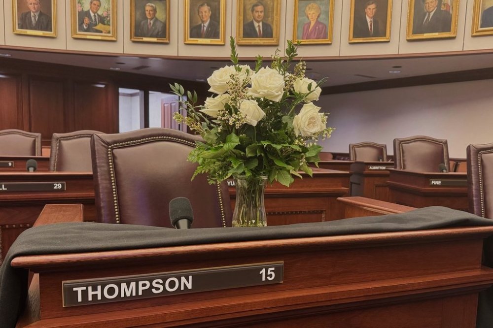 A bouquet of flowers and a black cloth adorn the desk of the late Democratic State Sen. Geraldine Thompson on the floor of the Florida Senate in Tallahassee, Fla. on Wednesday, March 12, 2025. (AP Photo/Kate Payne)
