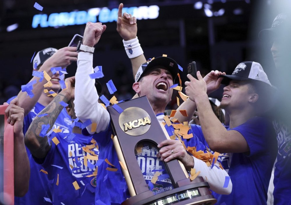 Florida head coach Todd Golden celebrates following his team's win over Texas Tech in the Elite Eight of the NCAA college basketball tournament, Saturday, March 29, 2025, in San Francisco. (Scott Strazzante/San Francisco Chronicle via AP)