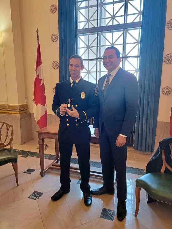 WFPS Lt. Romeo Petit (left) and Premier Wab Kinew had a private meeting in the Manitoba Legislature in January, when Petit received the King Charles III Coronation Medal. (Supplied)