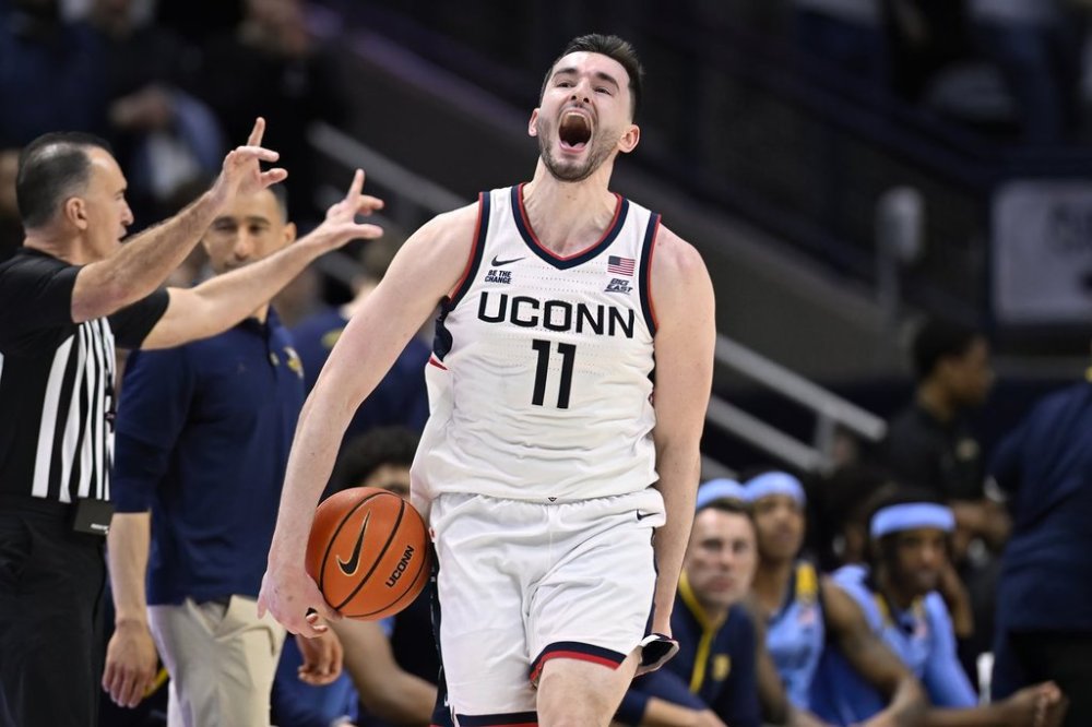 UConn forward Alex Karaban (11) reacts at the end of an NCAA basketball game against Marquette, Wednesday, March 5, 2025, in Storrs, Conn. (AP Photo/Jessica Hill)