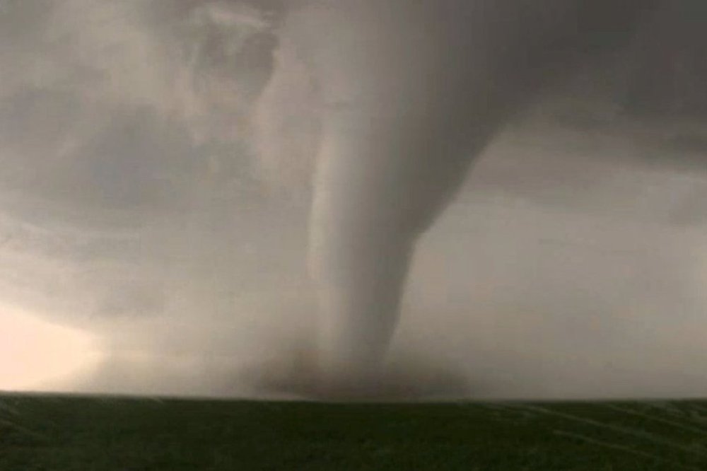 FILE - This image made from a May 24, 2016 video by KWTV-KOTV, shows a funnel cloud moving across the field near Dodge City in Ford County, Kan. (KWTV-KOTV via AP, File)