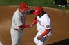 Philadelphia Phillies manager Rob Thomson, left, and Washington Nationals manager Dave Martinez, right, shake hands before an opening-day baseball game, Thursday, March 27, 2025, in Washington. (AP Photo/Nick Wass)