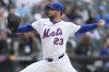 New York Mets pitcher David Peterson throws during the first inning of a baseball game against the Toronto Blue Jays, Sunday, April 6, 2025, in New York. (AP Photo/Seth Wenig)
