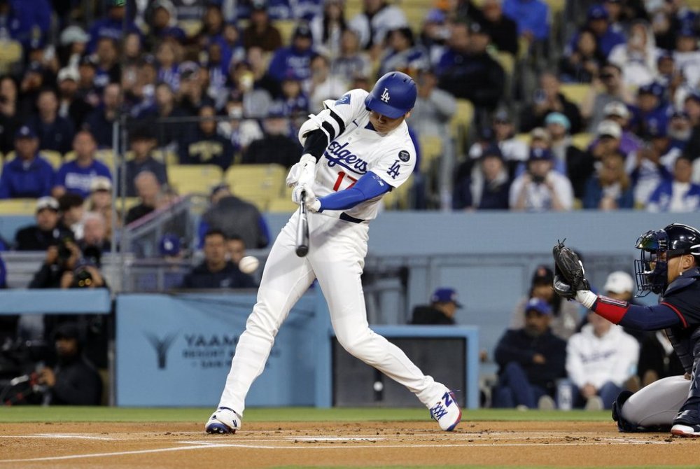 Los Angeles Dodgers' Shohei Ohtani hits a ground out against the Atlanta Braves during the first inning of a baseball game Tuesday, April 1, 2025, in, Los Angeles. (AP Photo/Kevork Djansezian)