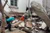 Volunteers look for survivors near damaged building Friday, March 28, 2025, in Naypyitaw, Myanmar. (AP Photo/Aung Shine Oo)