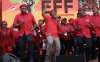 FILE - Leader of the Economic Freedom Fighters (EFF) party, Julius Malema, centre, with party members sing and dance after addressing supporters during an election rally at Orlando Stadium in Soweto, South Africa, Sunday, May 5, 2019. (AP Photo/Themba Hadebe, File)